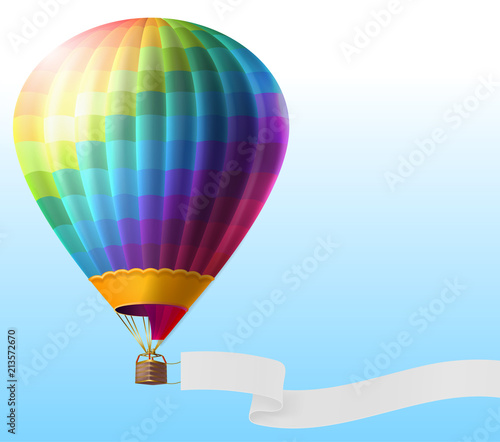 Vector realistic hot air balloon with rainbow stripes, flying on blue sky with blank ribbon for message. Colorful aerostat with basket for romantic travels. Template for poster, advertising banner