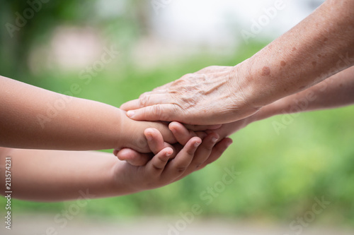 hand hold mom Concept
Love the giver
Of mothers with children On blurred background nature 