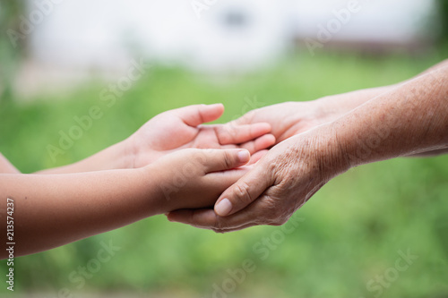 hand hold mom Concept  Love the giver  Of mothers with children On blurred background nature  © photosky99