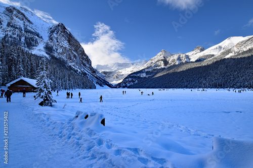 Lake Louise in winter a glacial lake frozen up covered with deep snow. Located in Banff NP Alberta Canada
