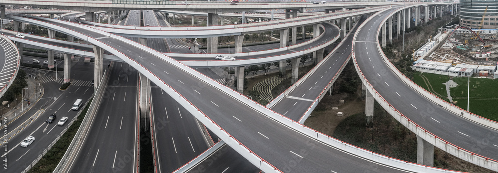 Aerial view of highway and overpass in city on a cloudy day Aerial view of highway and overpass in city on a cloudy day