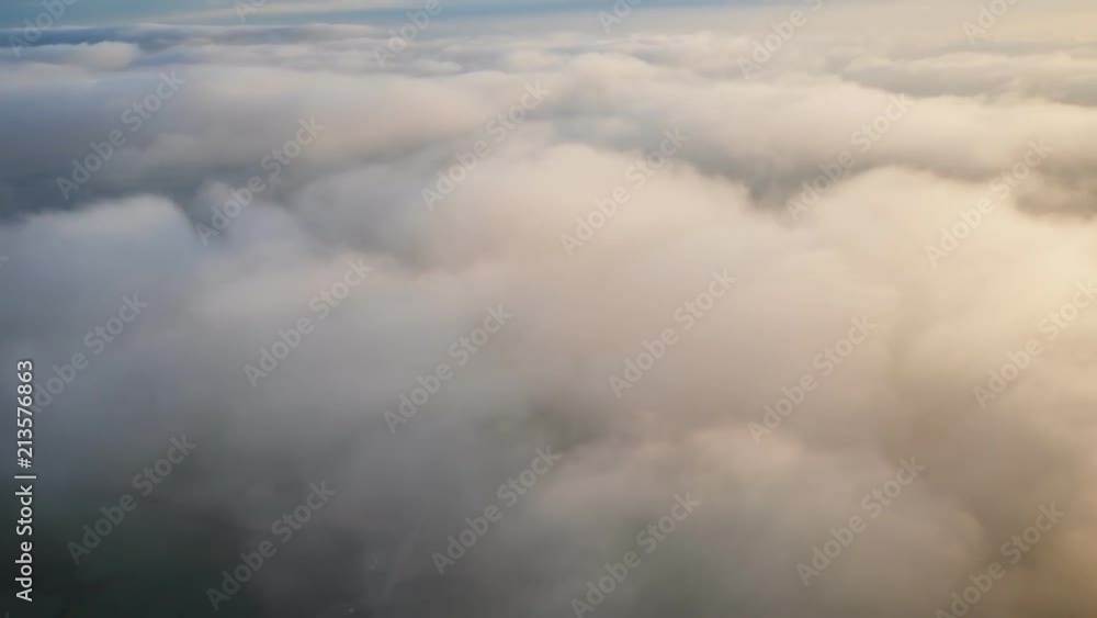 Landing an airplane and flying over clouds in the evening. Landing an airplane and flying over clouds in the evening.