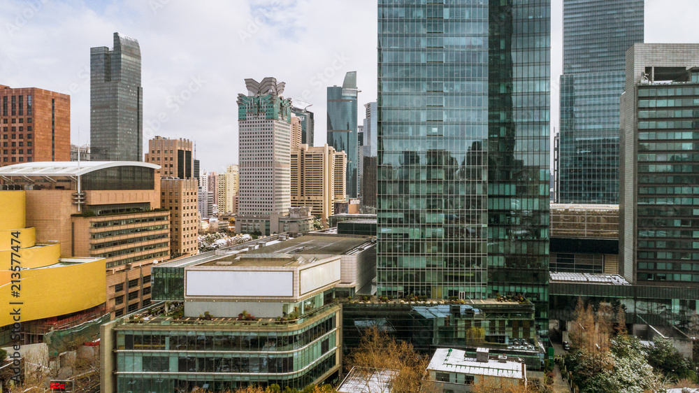 Fototapeta premium aerial view of downtown Shanghai near Jing An Temple and Nanjin Road after an unusual snowfall in the morning