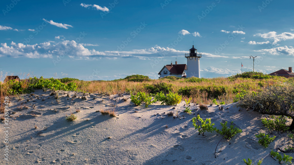 Lighthouse Point on beach dunes, Race Point Light Lighthouse in Cape Code, New England, Massachusetts, USA.