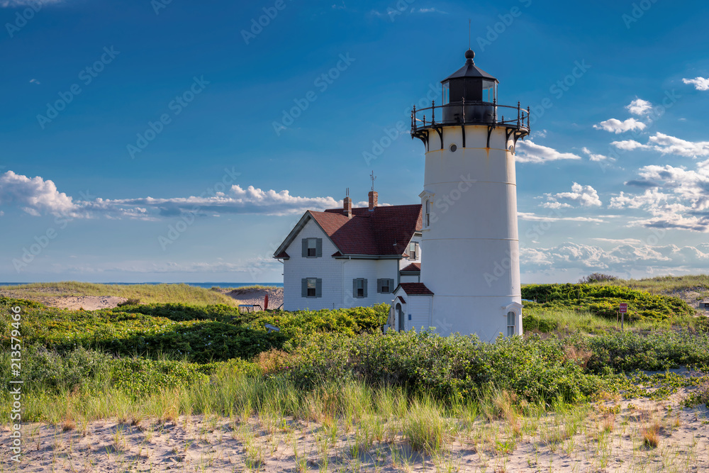 Lighthouse Point on beach dunes, Race Point Light Lighthouse in Cape Code, New England, Massachusetts, USA.