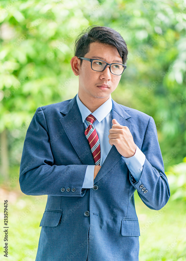 Business men portrait standing outside in a par Business men portrait standing outside in a par
