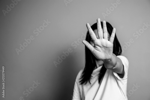 woman raised her hand for dissuade, campaign stop violence against women. Asian woman raised her hand for dissuade with copy space, black and white color