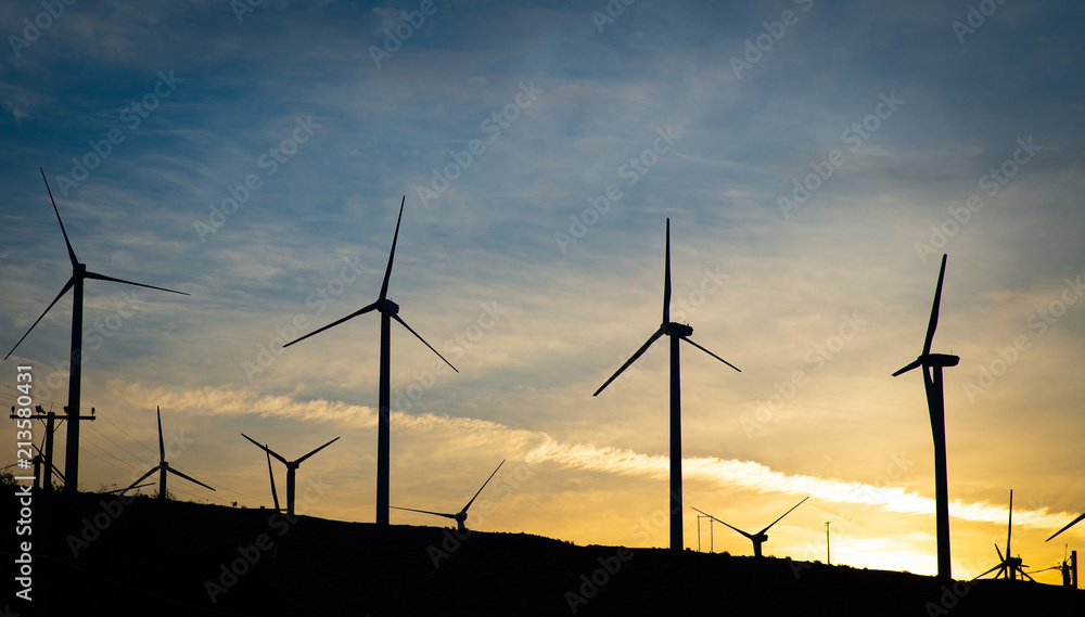 Fototapeta premium A group of wind turbines at Dawn