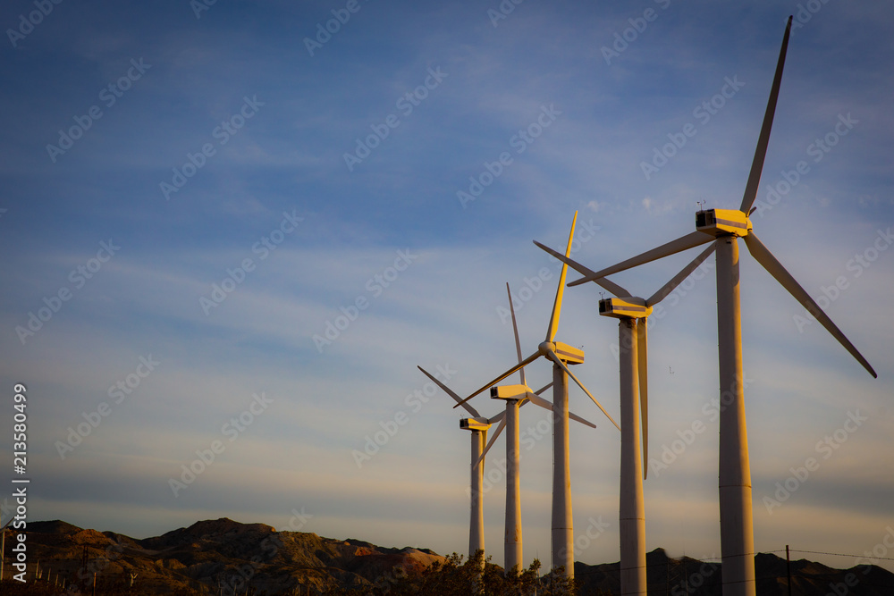 Fototapeta premium A row of Wind Turbines with Copy Space