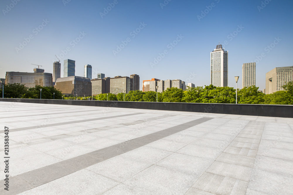 Panoramic skyline and modern business office buildings with empty road,empty concrete square floor