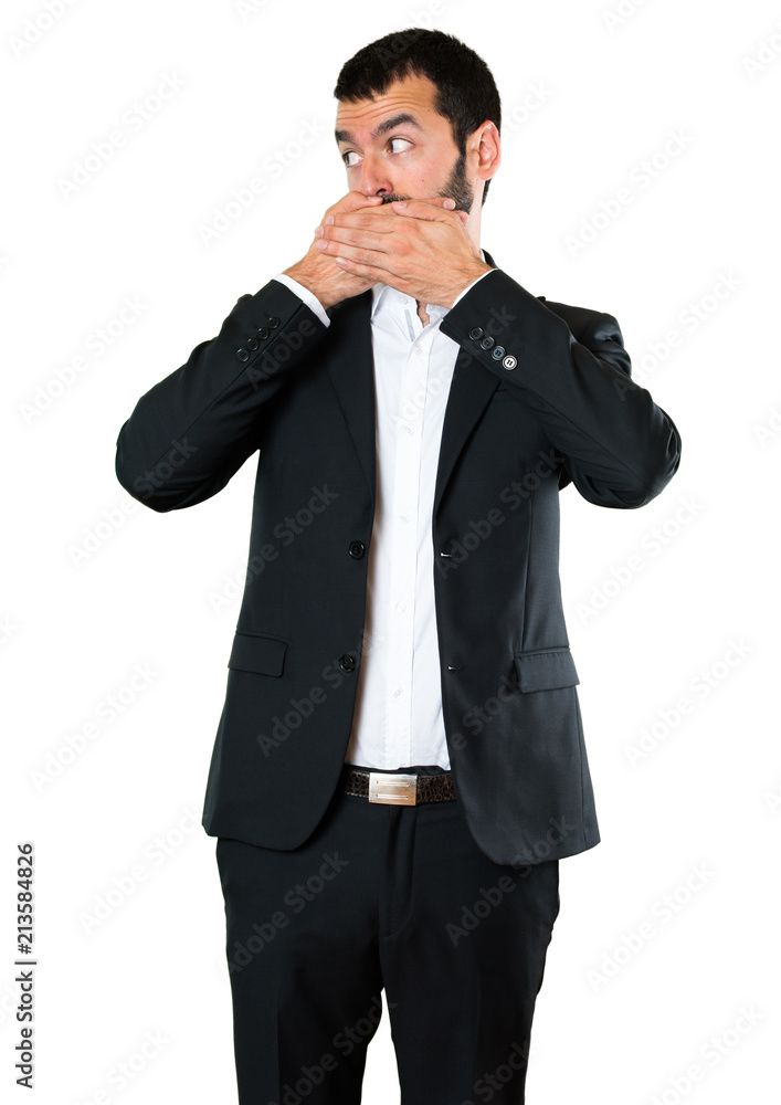 Handsome businessman covering his mouth Handsome businessman covering his mouth