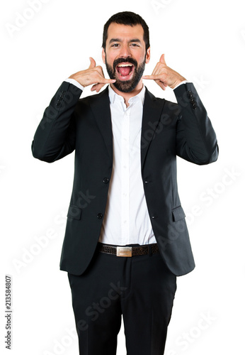 Handsome businessman making phone gesture