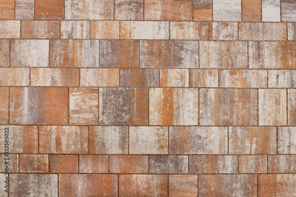 Naklejka premium Masonry made of smooth polished stone slabs of sandstone. Texture of a fragment of a wall of an old structure. A background for design and creative work. Decoration and exterior decoration