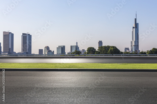 Panoramic skyline and modern business office buildings with empty road empty concrete square floor