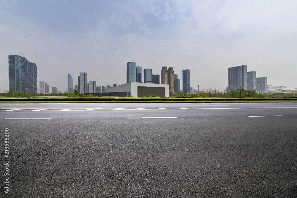 Panoramic skyline and modern business office buildings with empty road,empty concrete square floor