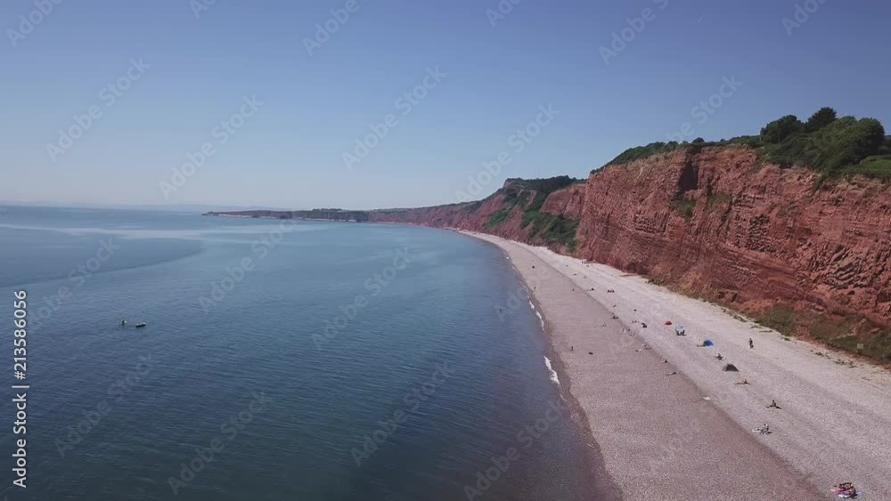 An aerial view of the beautiful pebble beaches of Budleigh Salterton, a small town on the Jurassic Coast in East Devon, England near Exeter. An aerial view of the beautiful pebble beaches of Budleigh Salterton, a small town on the Jurassic Coast in East Devon, England near Exeter.
