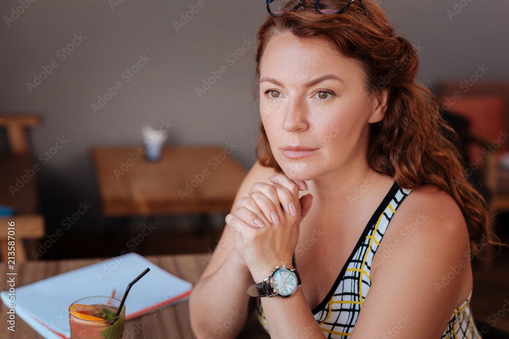Green-eyed woman. Green-eyed mature woman feeling relaxed and rested while looking at her husband