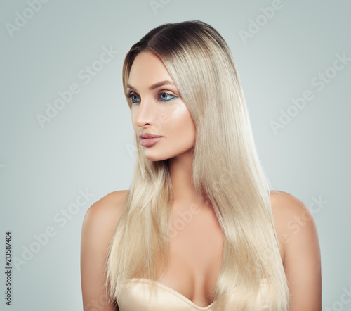 Beautiful Woman with Fresh Skin and Healthy Blonde Hair. Facial treatment. Cosmetology, beauty, haircare and spa