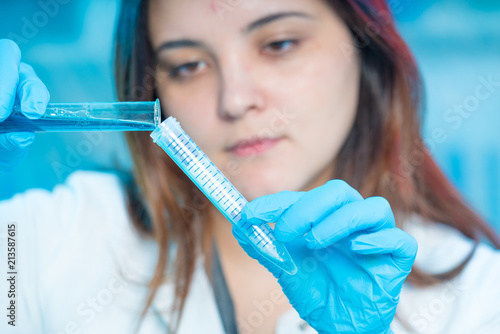 female technician in medical laboratory  hospital Petri dish test