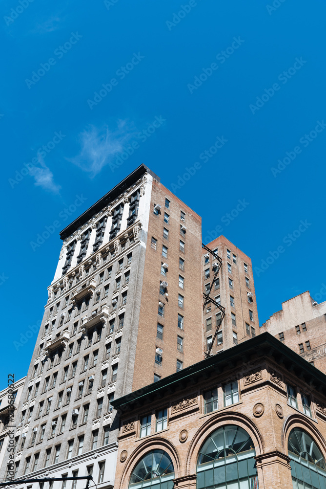 Low angle view of old buildings and water towers in New York Cit Low angle view of old buildings and water towers in New York Cit