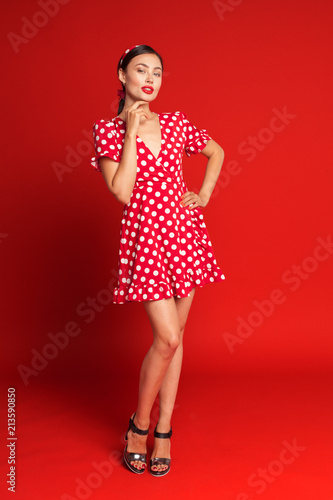 Portrait of a funny emotional young woman. Pin-up style. © fotofabrika