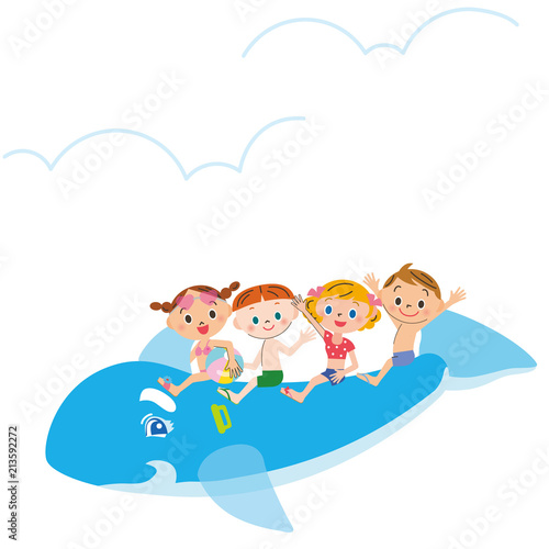 イルカの浮き輪に乗る子供達