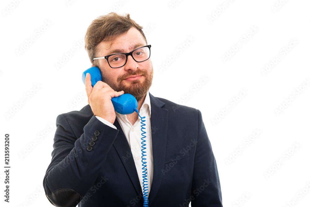 Portrait of business man talking on blue receiver. Portrait of business man talking on blue receiver.