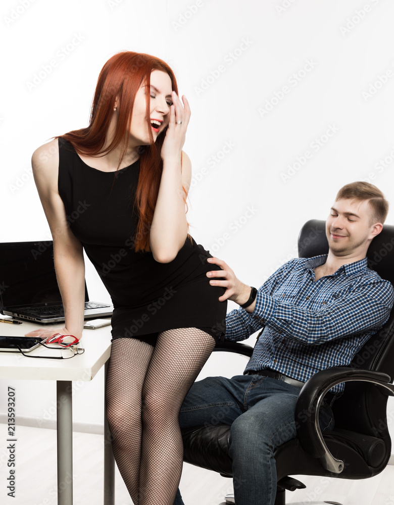 sexy secretary flirting with boss in the workplace. sexual harassment ...