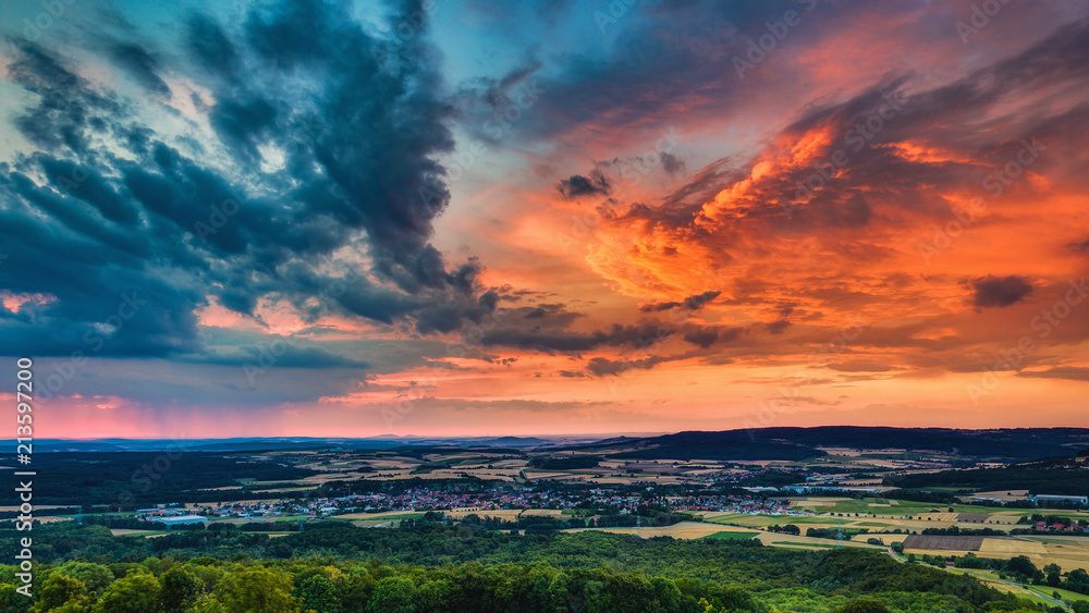 Obraz premium Dramatic Clouds at Sunset, orange blue contrast