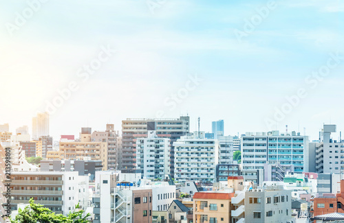 Asia Business concept for real estate and corporate construction - panoramic modern city urban skyline bird eye aerial view under sun & blue sky in Tokyo, Japan