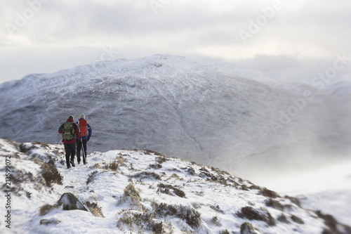 Winter climbers on a snow covered mountain in Scotland