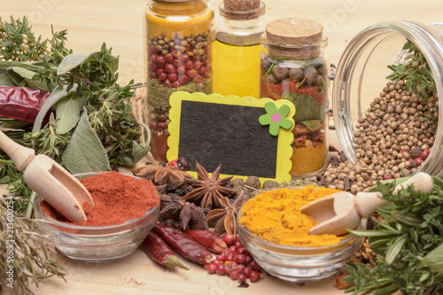 Various spices on wooden background.