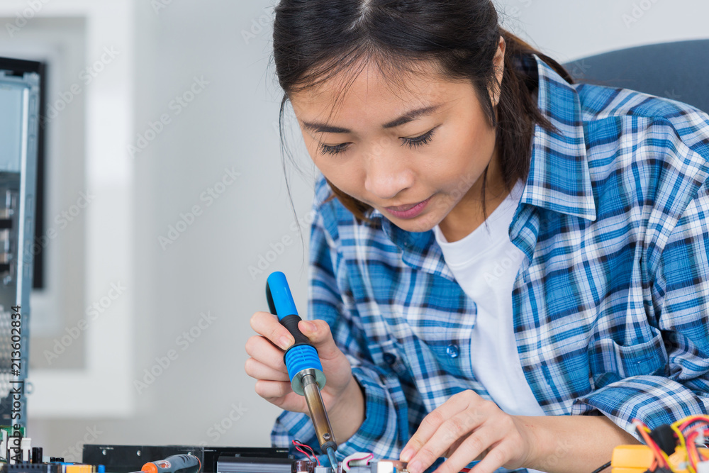 cute female engineer at home working on technology cute female engineer at home working on technology