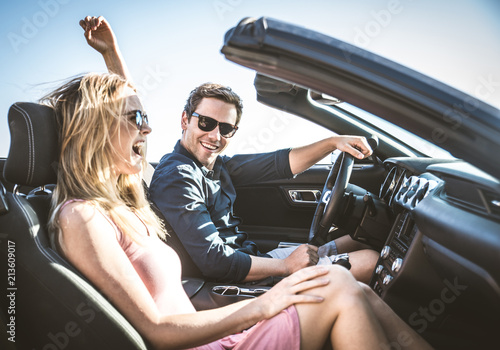 Couple on convertible car