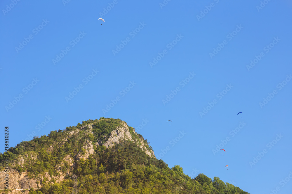 .Paragliders train on the lake Serre-Poncon. France. .Paragliders train on the lake Serre-Poncon. France.