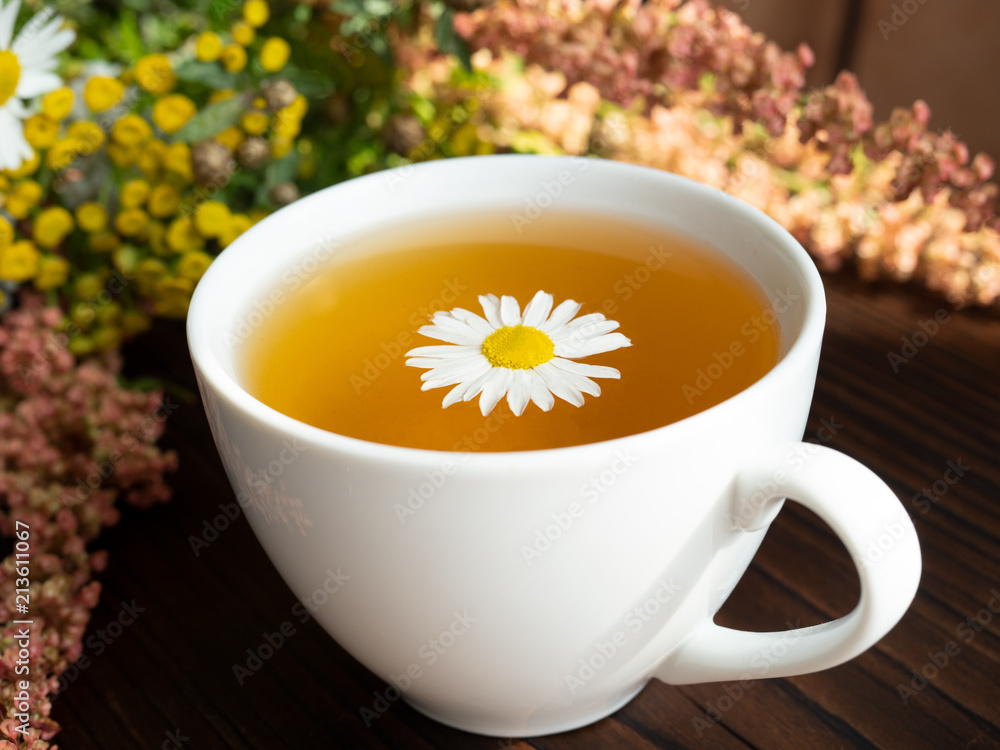 bouquet of flowers, a Cup of tea on a dark background bouquet of flowers, a Cup of tea on a dark background