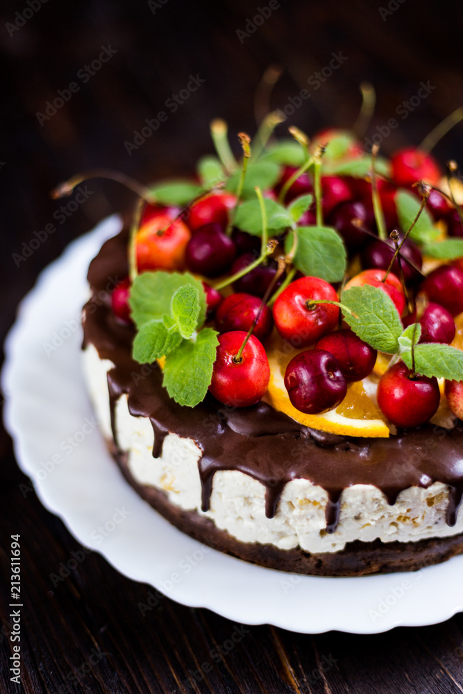 Cake with chocolate icing and fruit Cake with chocolate icing and fruit