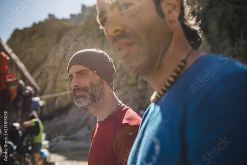 Two mountaineers resting at sunset close to mountain refugee photo