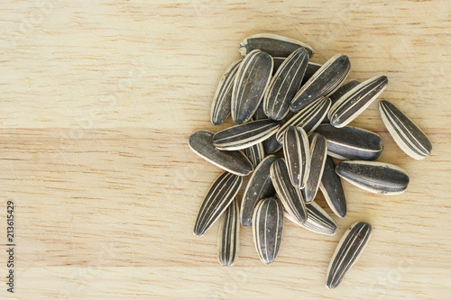 sunflower seeds for planting on wooden background