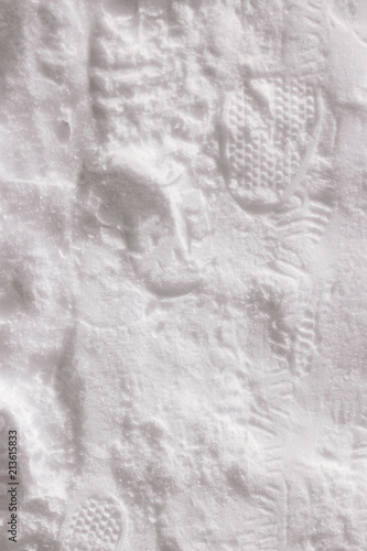 Footprints of people's shoes in the snow