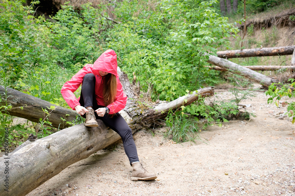 young redhead long hair woman travels in summer cloudy forest young redhead long hair woman travels in summer cloudy forest