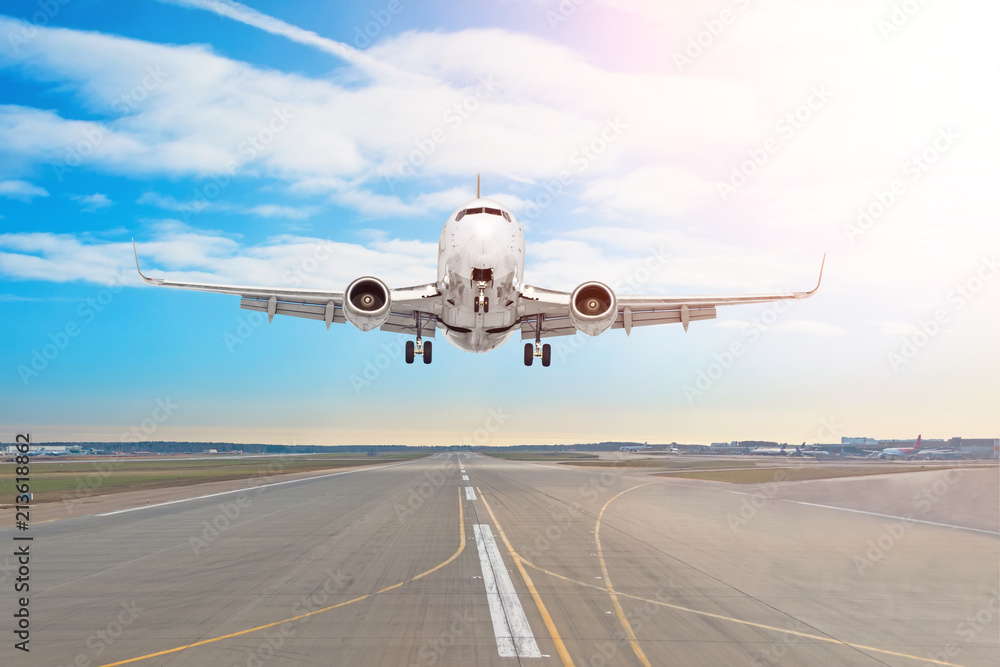 Passenger aircraft with on the asphalt landing on a runway airport, motion blur. Passenger aircraft with on the asphalt landing on a runway airport, motion blur.