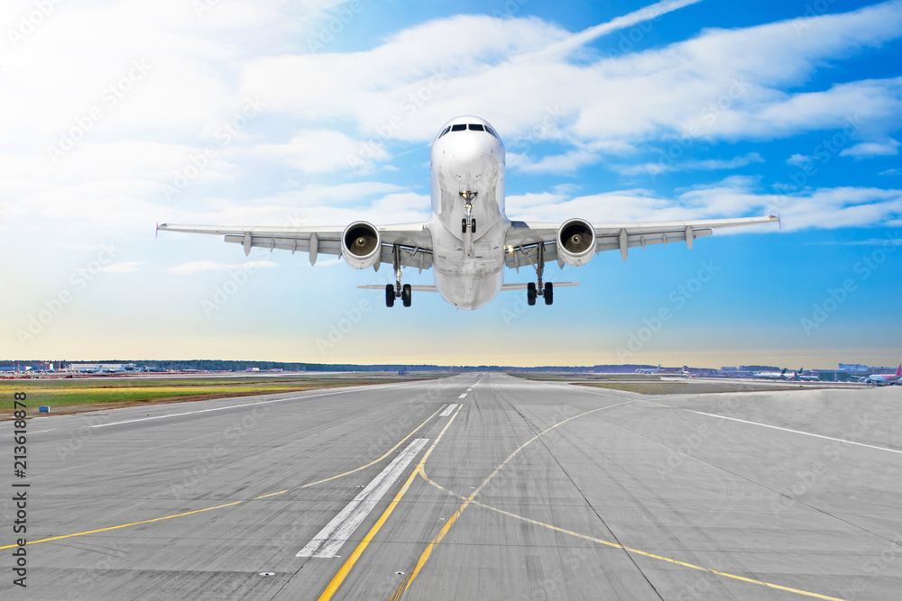 Fototapeta premium Passenger airplane the asphalt landing on a runway airport.