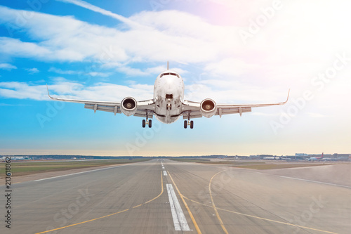 Passenger aircraft with on the asphalt landing on a runway airport, motion blur.