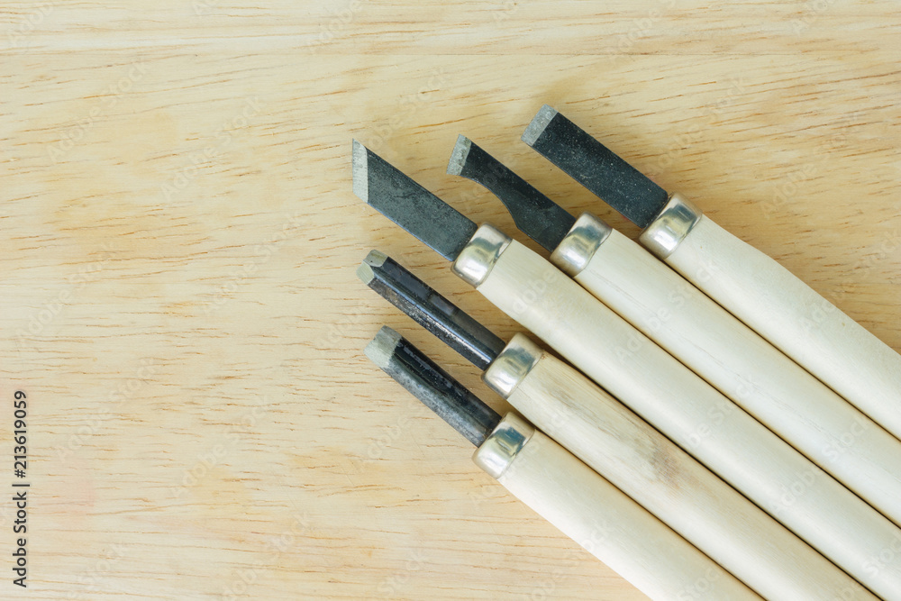 chisel carving set on wooden background