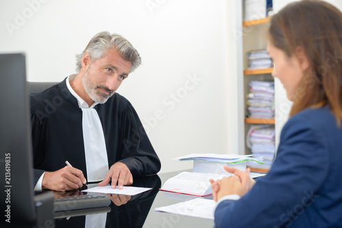Magistrate talking to client