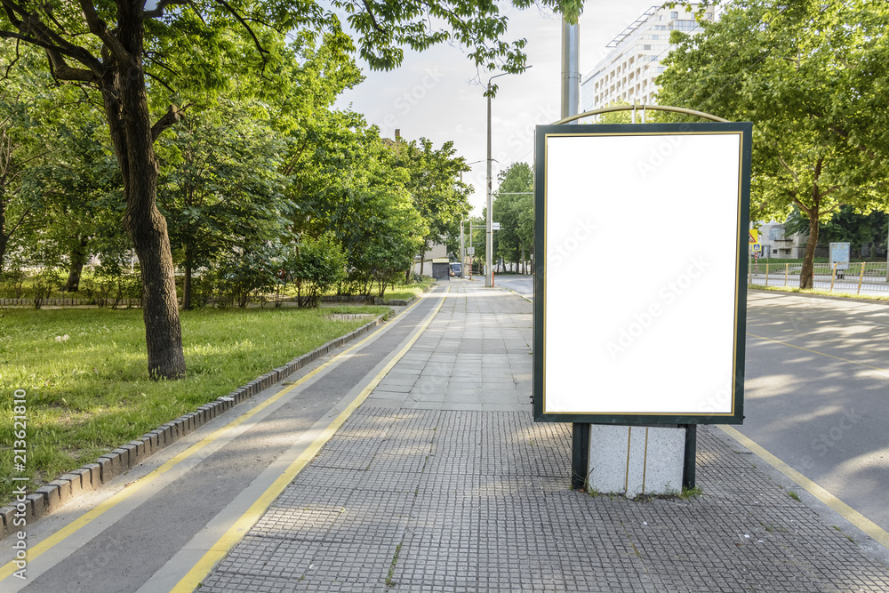 billboard on a busy street with bike lane. billboard on a busy street with bike lane.