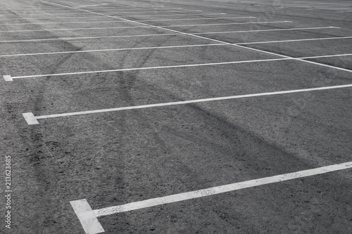 Parking places, asphalt, tire tracks.