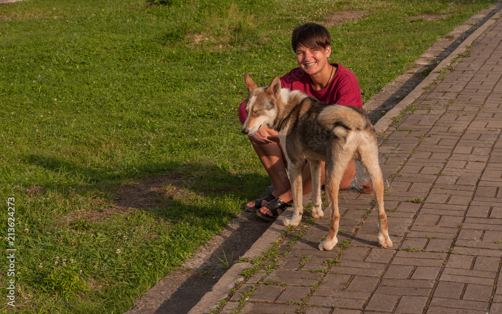 The girl with the dog near the train station The girl with the dog near the train station