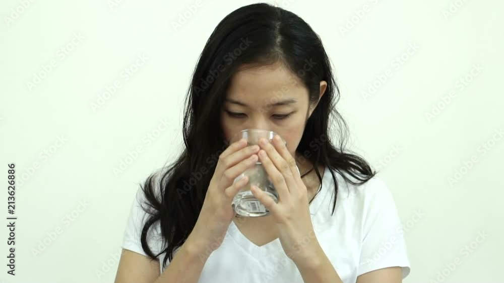 Asian woman drinking water 8 cup a day for healthy skin and body slow motion video Asian woman drinking water 8 cup a day for healthy skin and body slow motion video